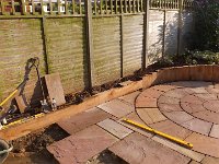 The circular patio takes shape. The slabs are being laid over the old patio.